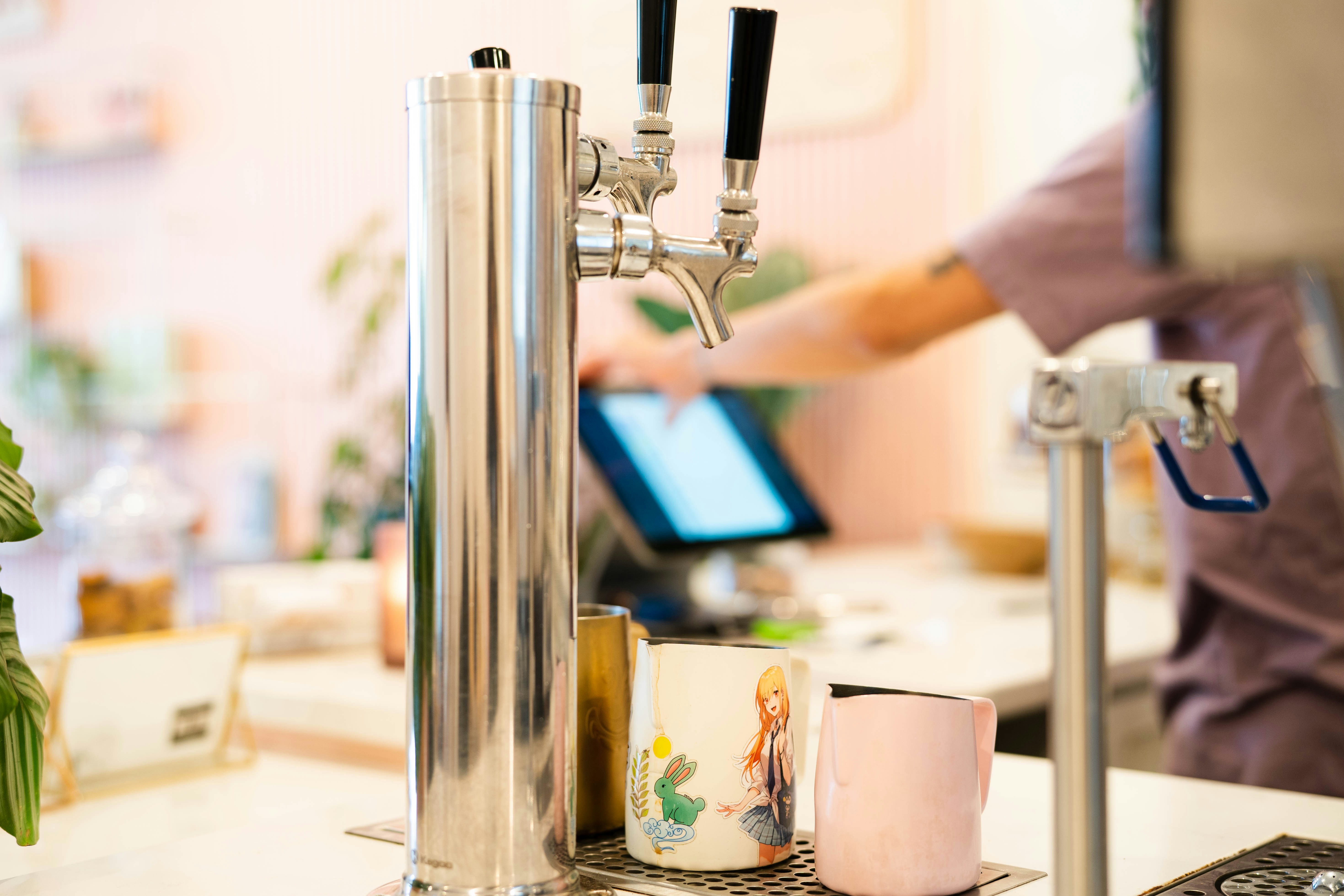 a coffee maker with a coffee cup