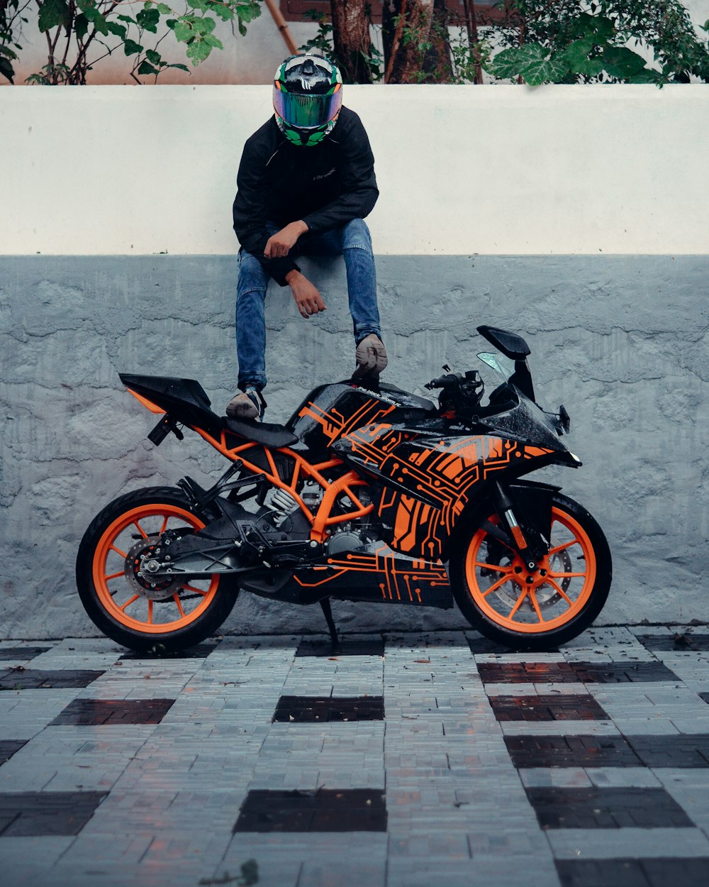 a man sitting on a motorcycle