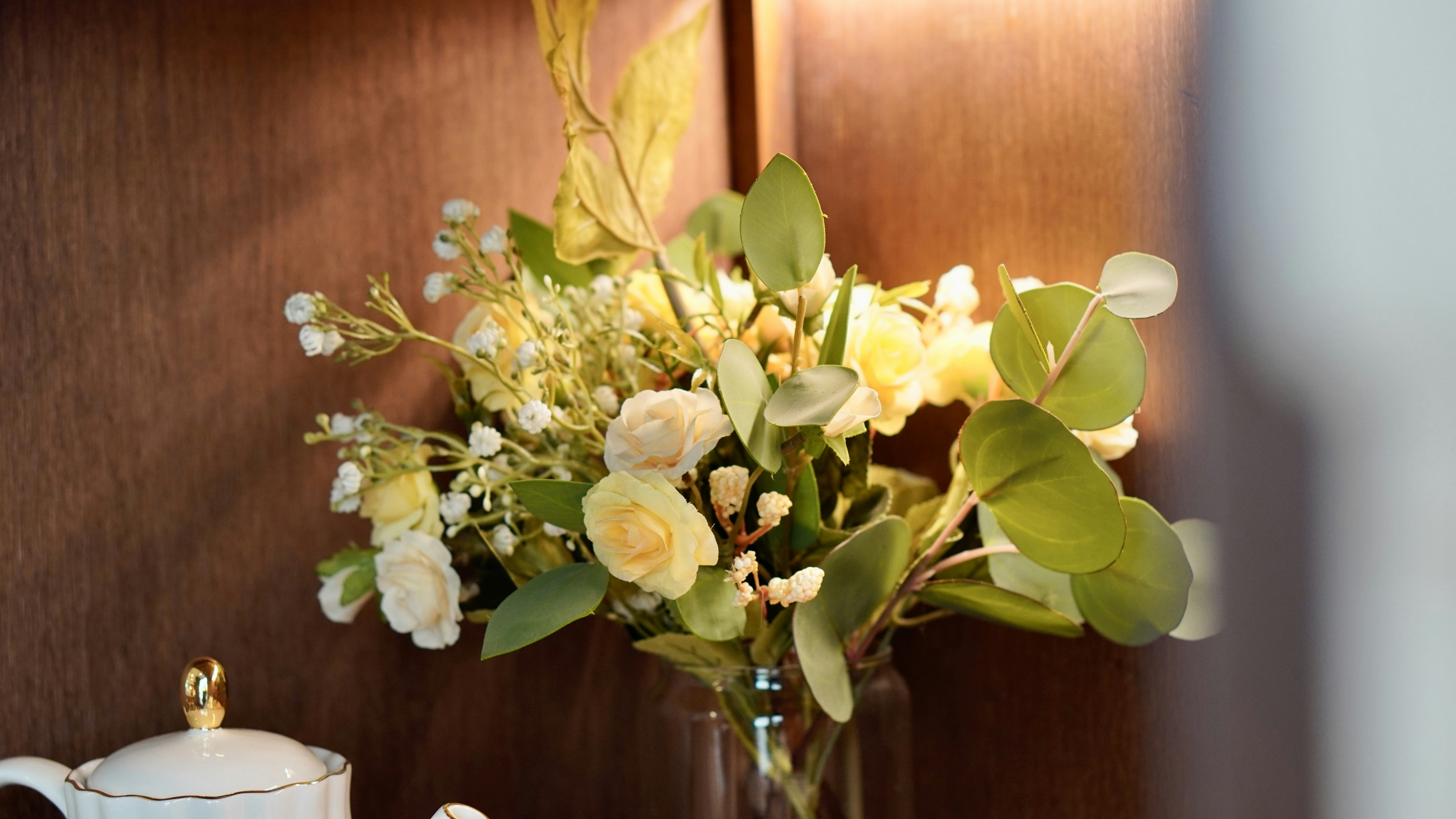 a vase with white flowers