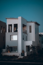 a white building with a blue sky with Rietveld Schröder House in the background