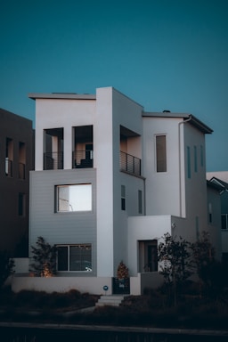a white building with a blue sky with Rietveld Schröder House in the background