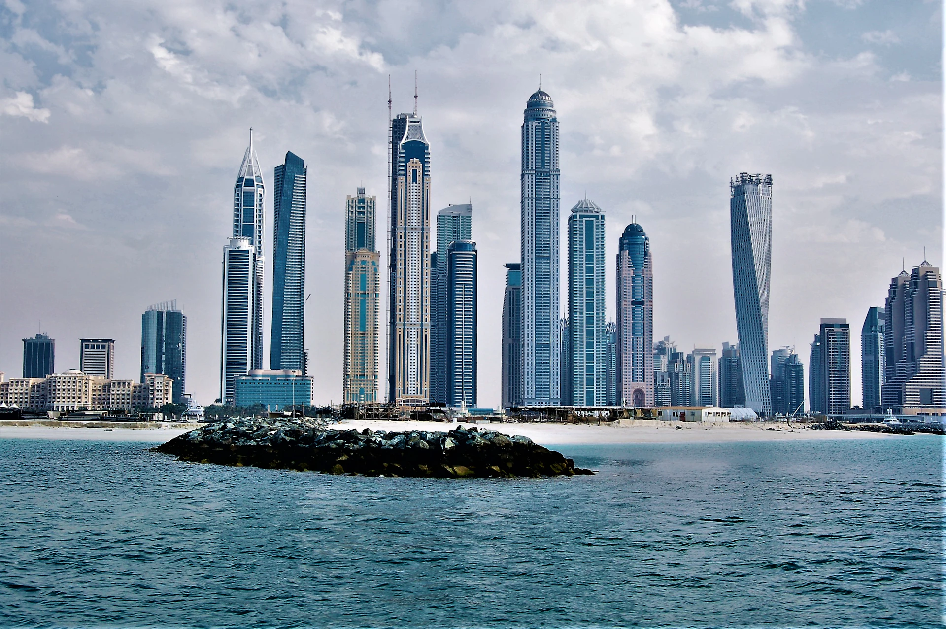 Sharjah city skyline seen across the water — Shops in Sharjah
