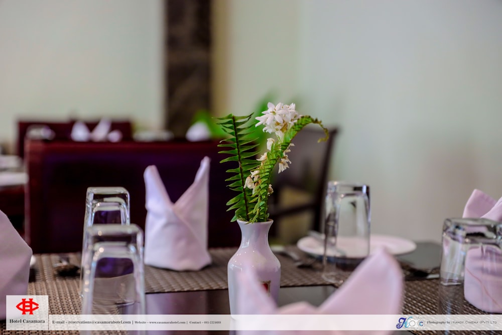 a vase with flowers on a table