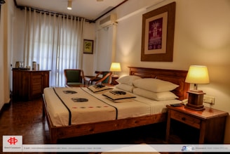 a hotel room with a bed and a desk