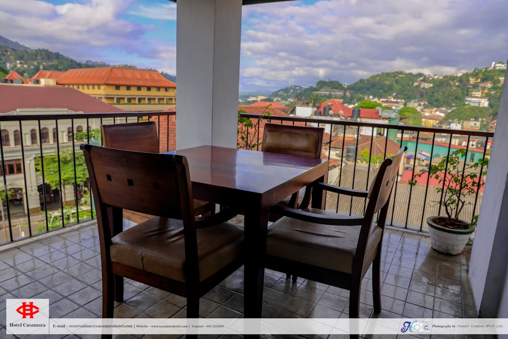 a table and chairs on a balcony