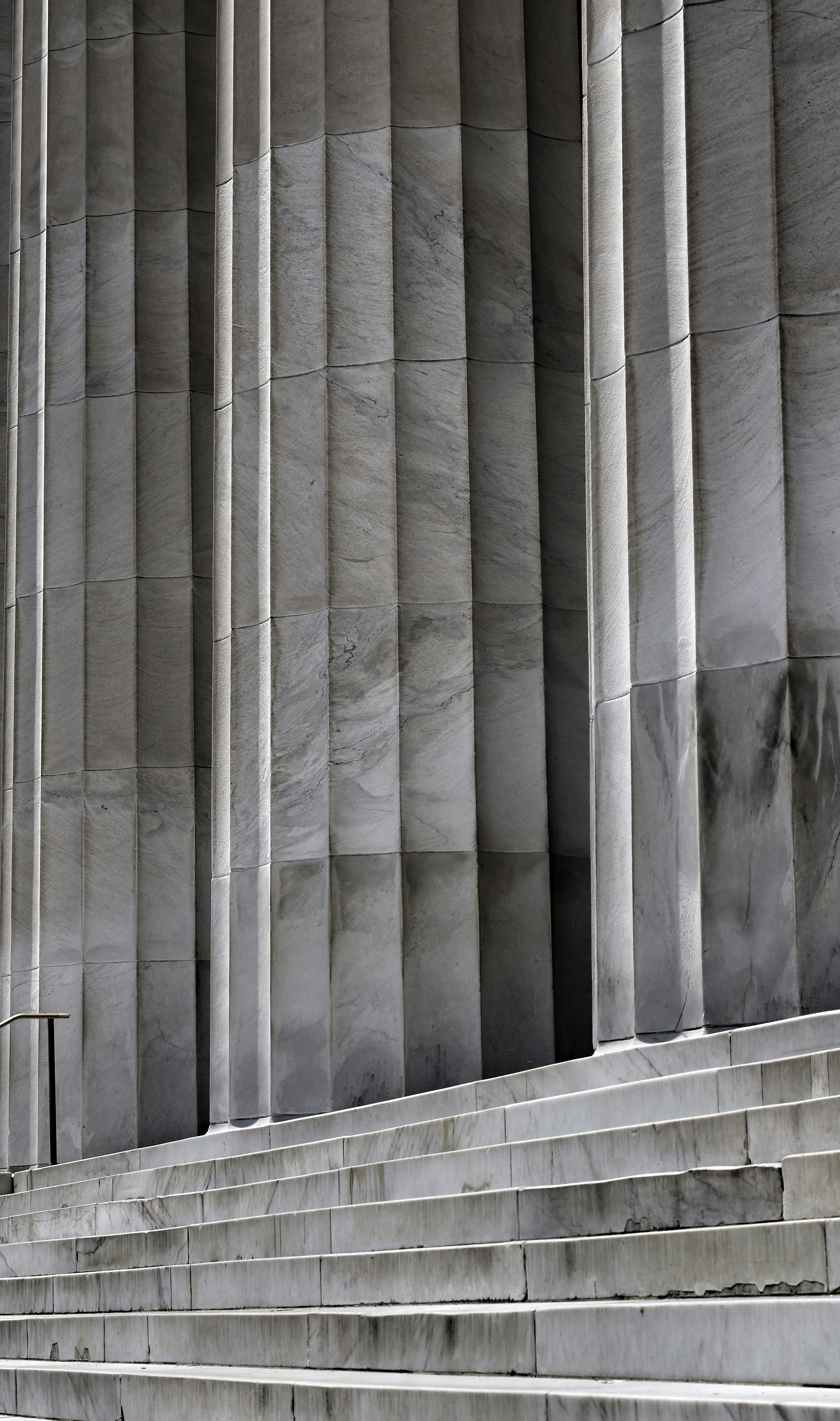 A grey wall with a wood railing photo – Free Grey Image on Unsplash