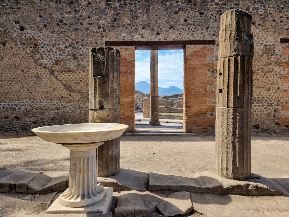 a stone building with a round table