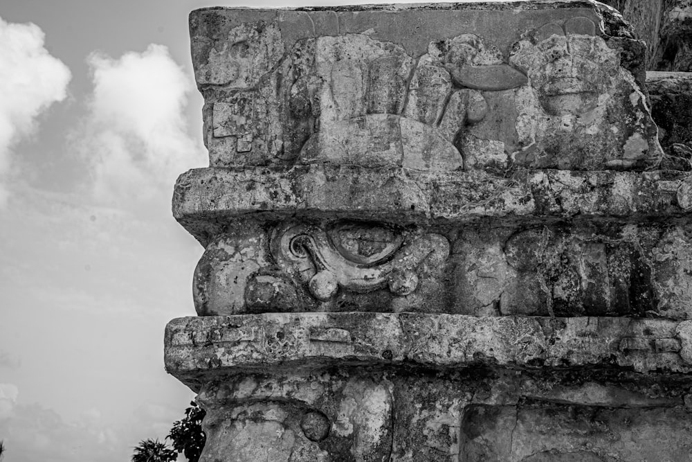 a stone monument with a lion and a lion on it