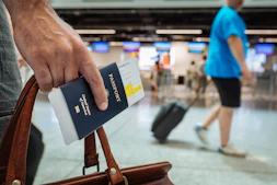 a hand holding a book