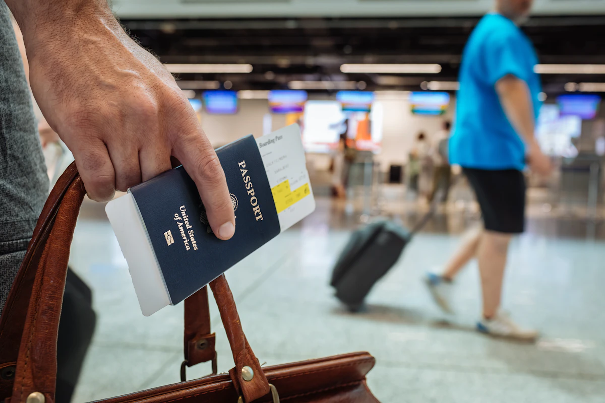 Passengers queueing at an airport passport control hall