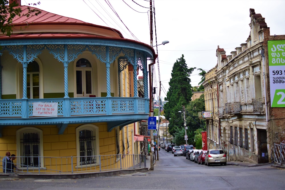 a street with cars and buildings on the side