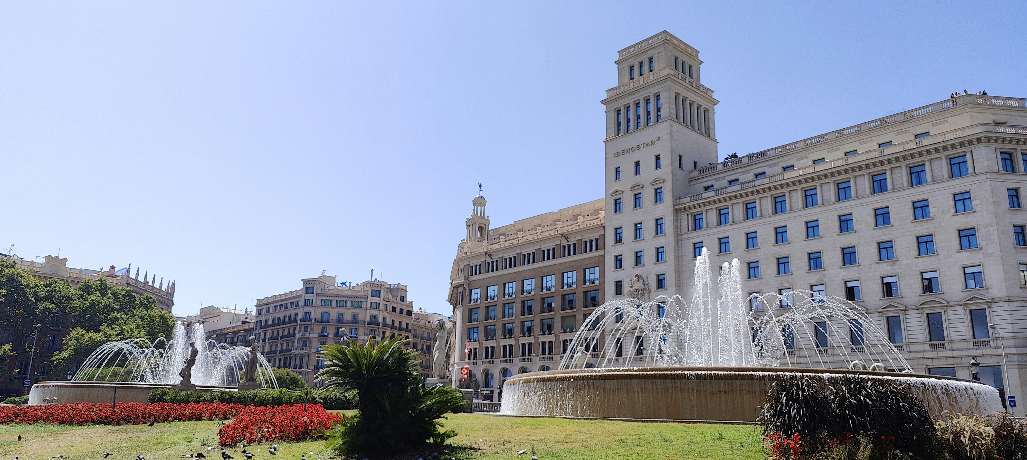 a large building with a fountain in front of it