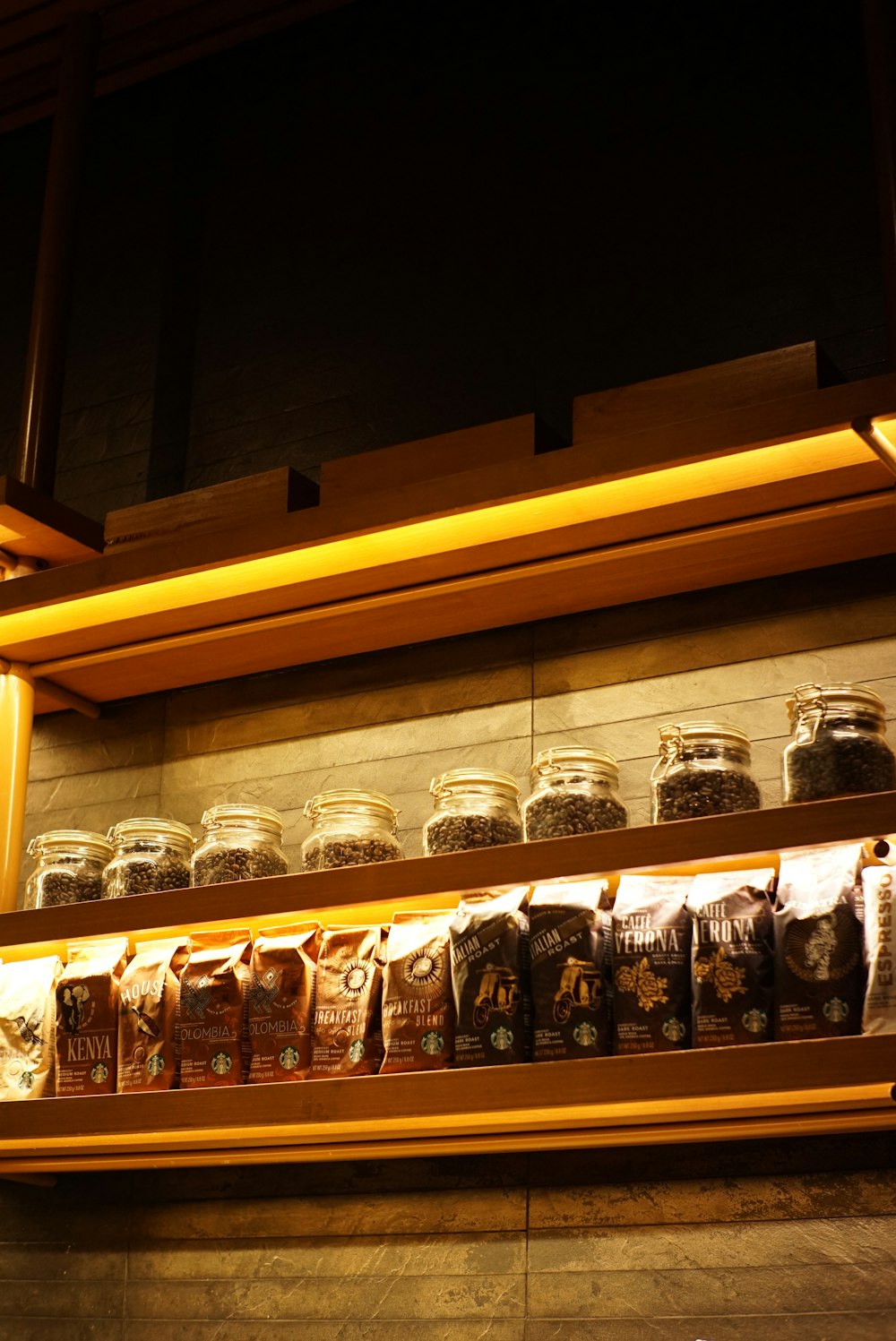 a shelf with glass jars on it