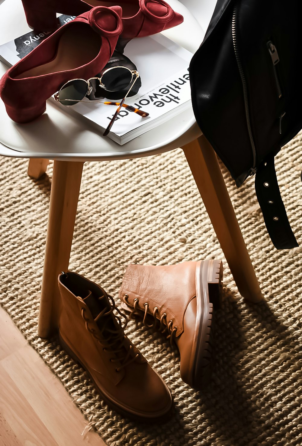 a pair of brown shoes on a wooden table