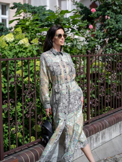 a woman standing on a balcony