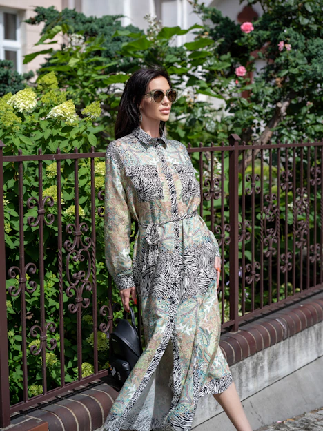 a woman standing on a balcony