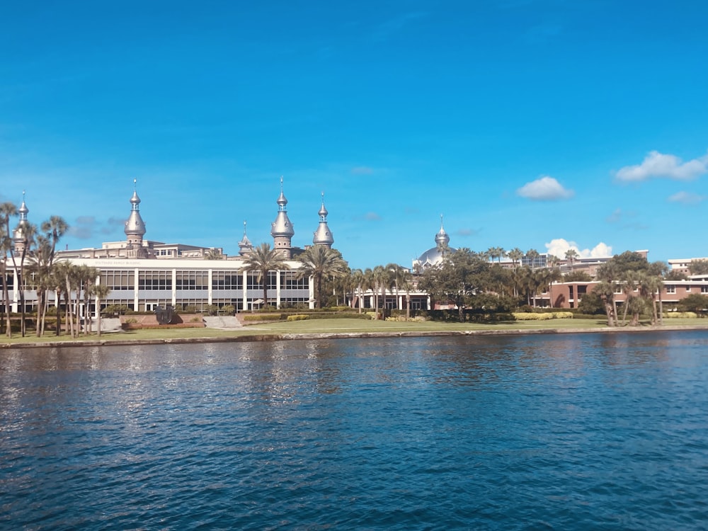 a body of water with a building in the background