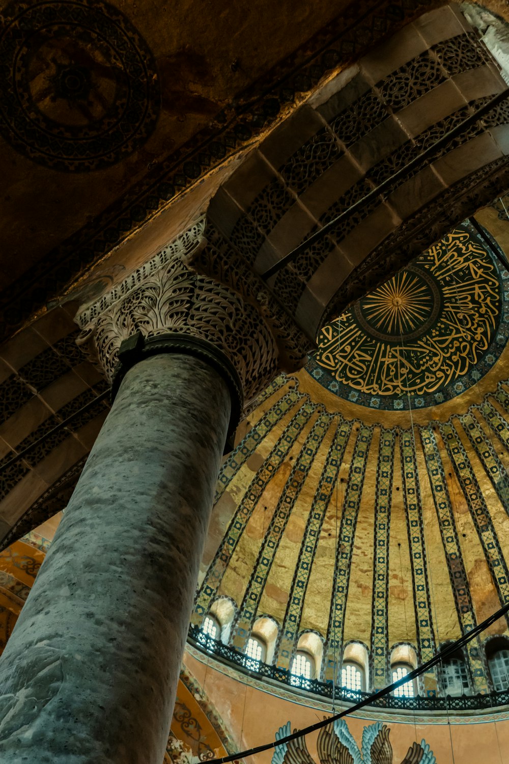 a large ornate ceiling with a large arched ceiling