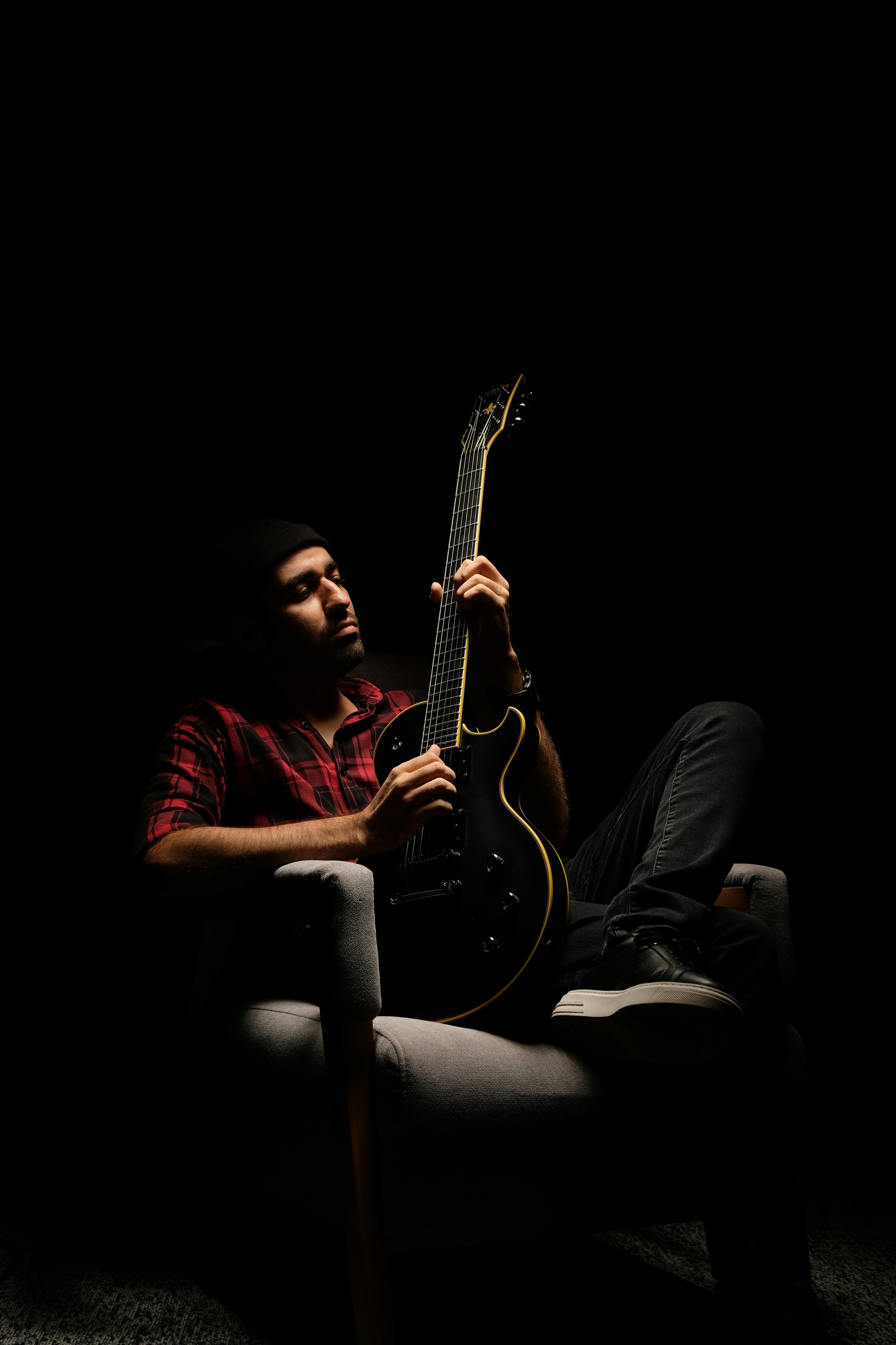 a man playing a guitar