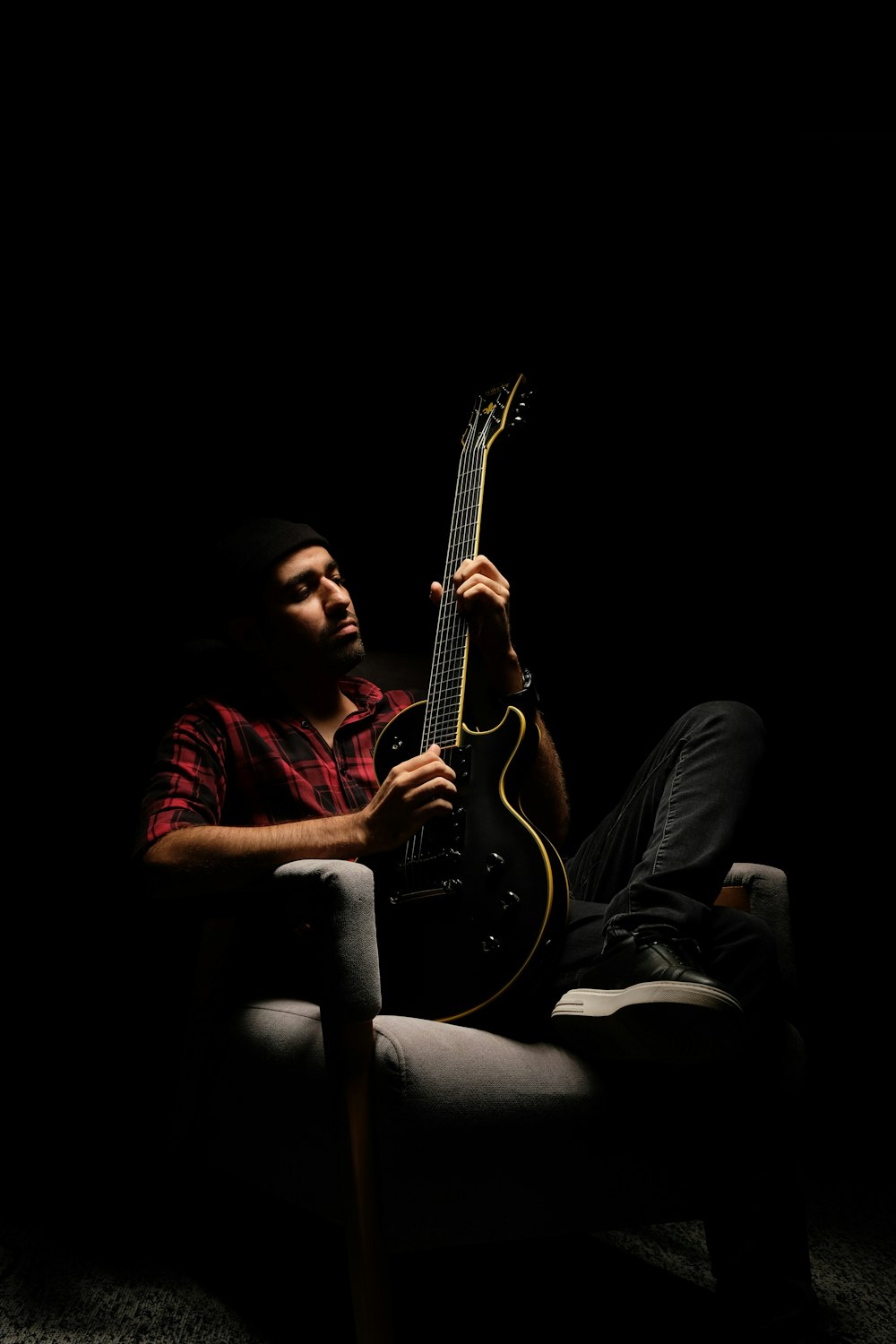 a man playing a guitar