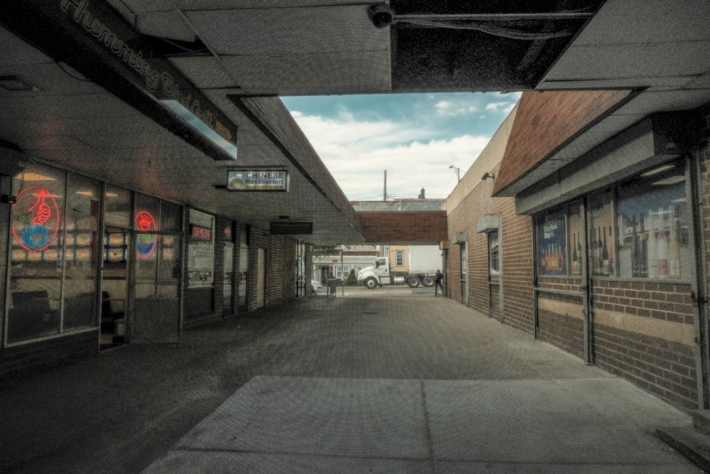 a long road with cars parked on the side