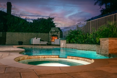 a swimming pool with a building in the background