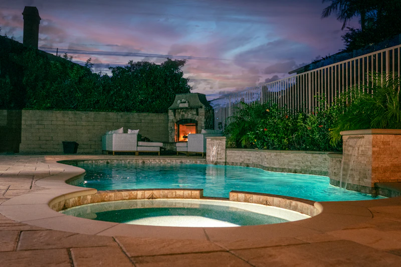 Travertine pool deck and coping cleaned during a surface service visit