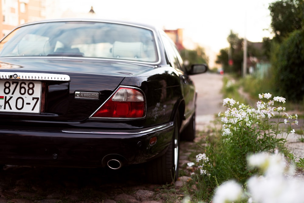 a black car parked on a street