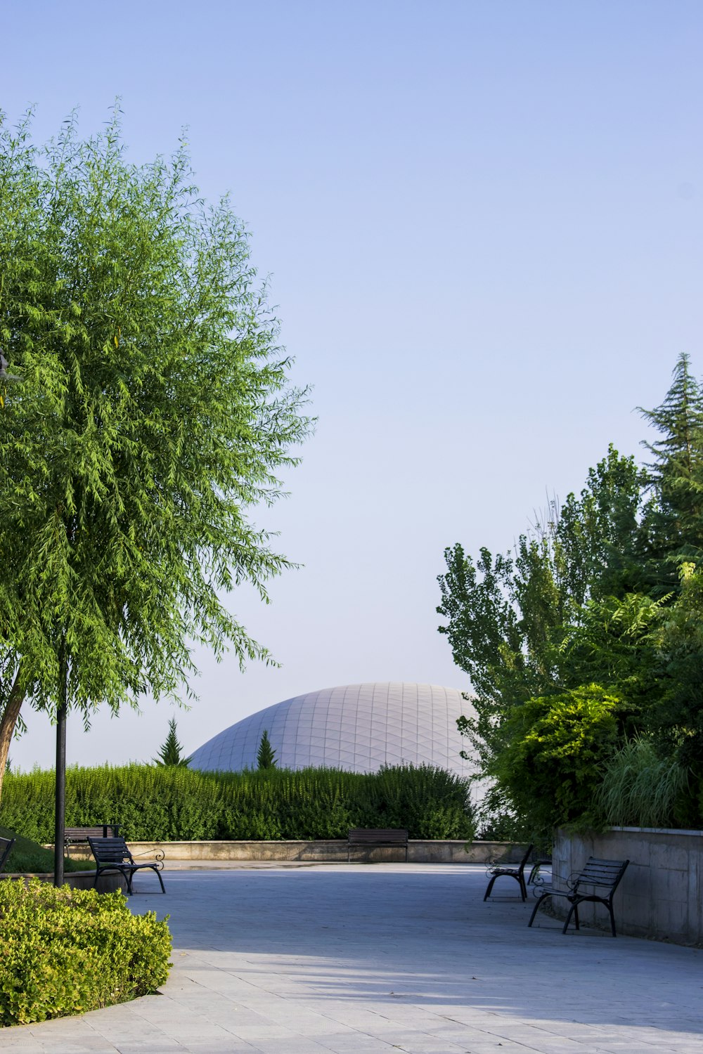 a large building with trees in front of it