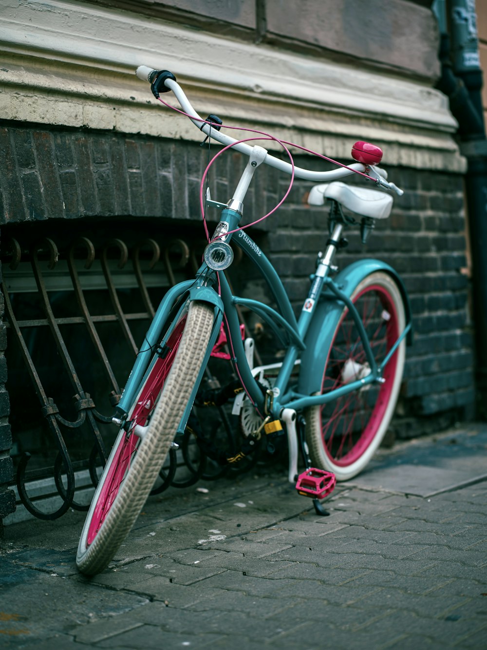 a bicycle parked on a sidewalk