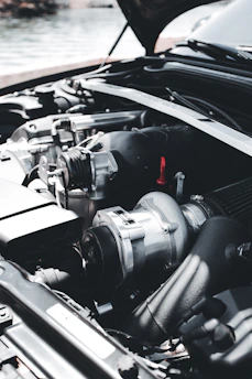 a car engine with a black hood