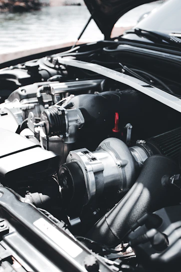 a car engine with a black hood