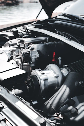 a car engine with a black hood