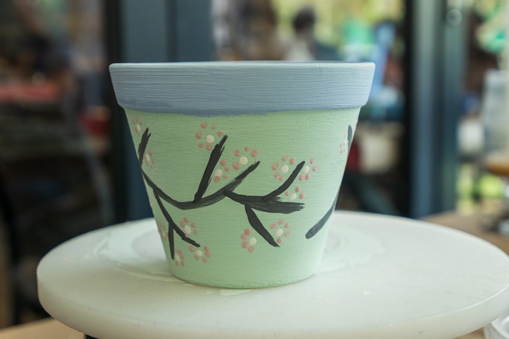 a cup with a drawing on it