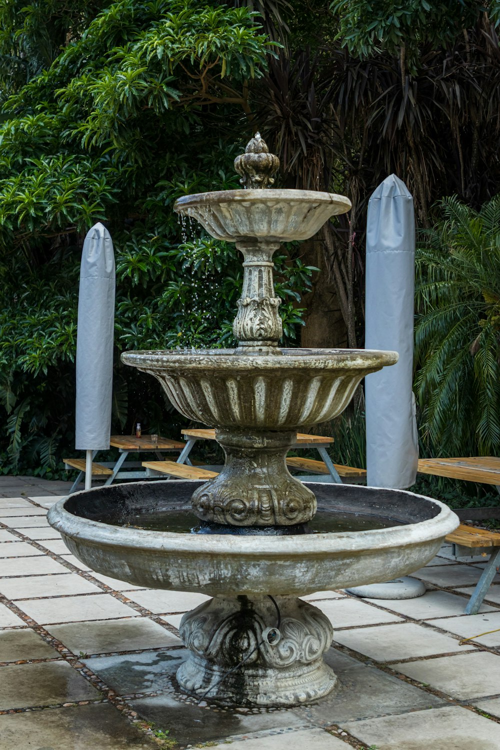 a water fountain in a garden