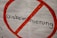 An anti-discrimination sign is depicted with the word 'Diskriminierung' crossed out in red. The background is a plain white, and the letters are bold and black.