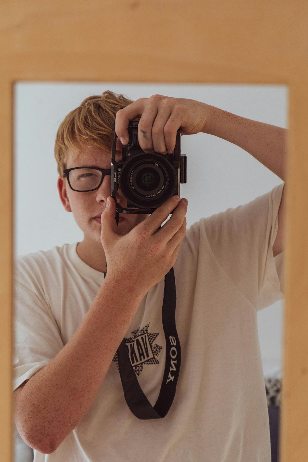 a man holding a camera to his face