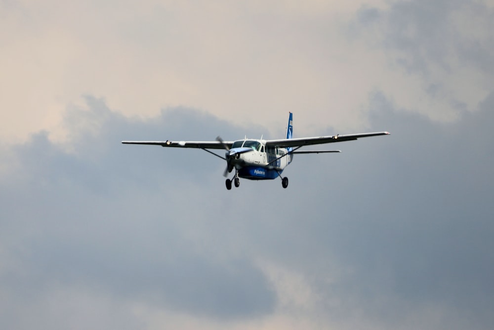 a small airplane flying in the sky