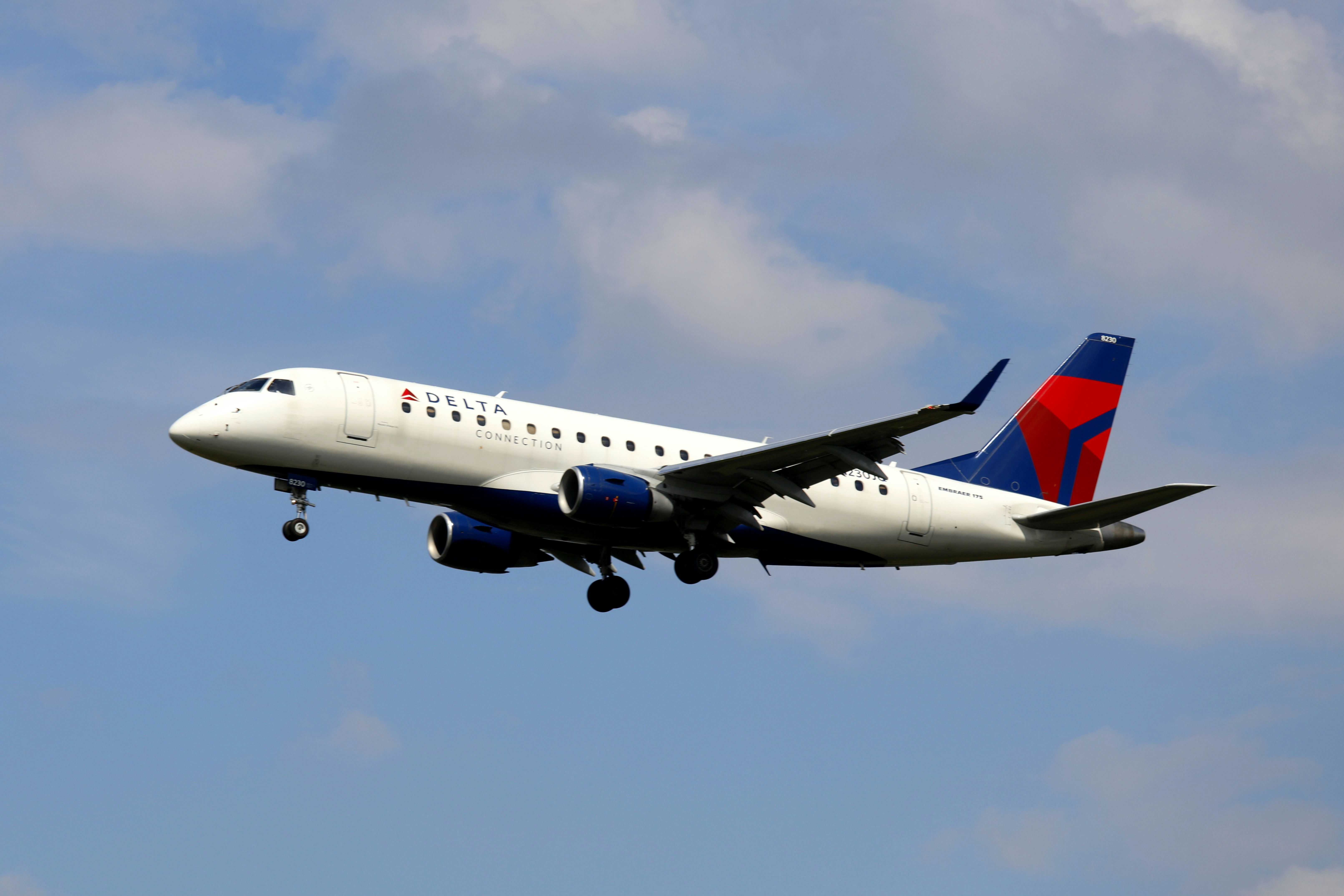 a large airplane flying in the sky, Delta Airlines Embraer 175 (N230JQ)