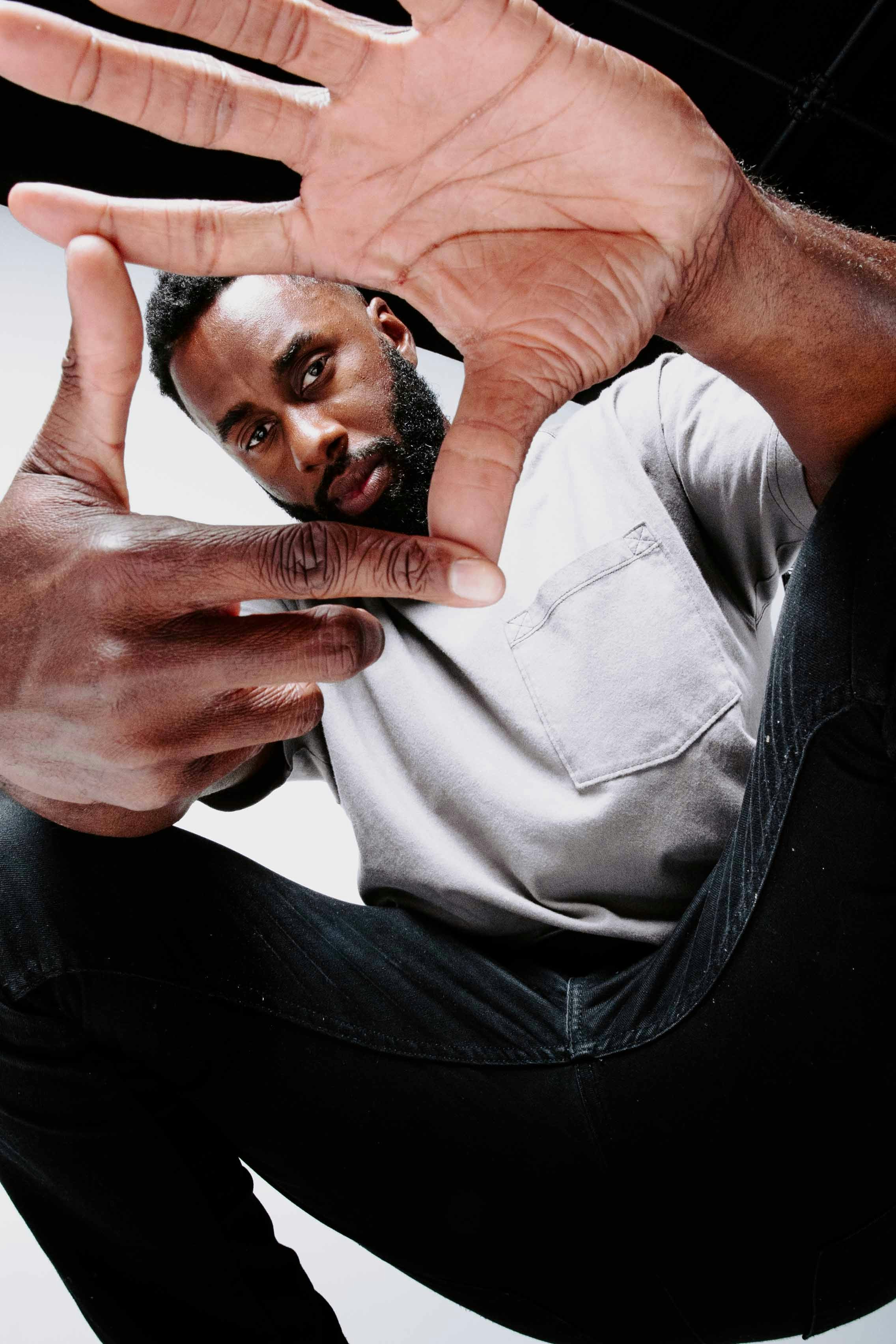 a man holding his hands up