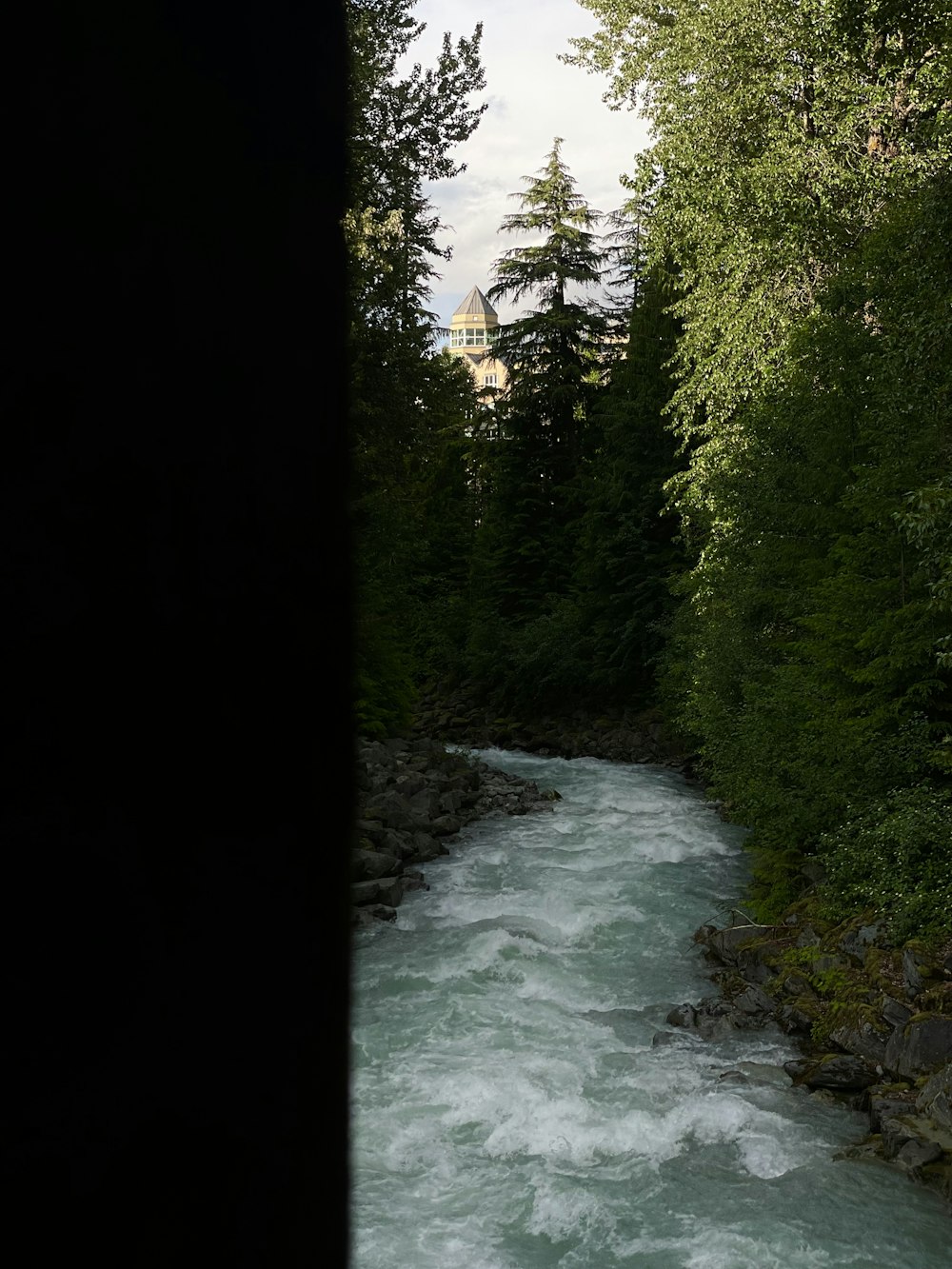 a river with a bridge over it