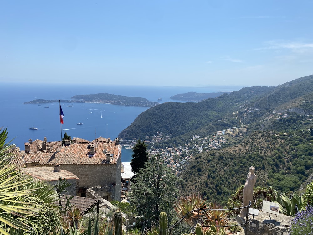 a building on a hill overlooking a body of water