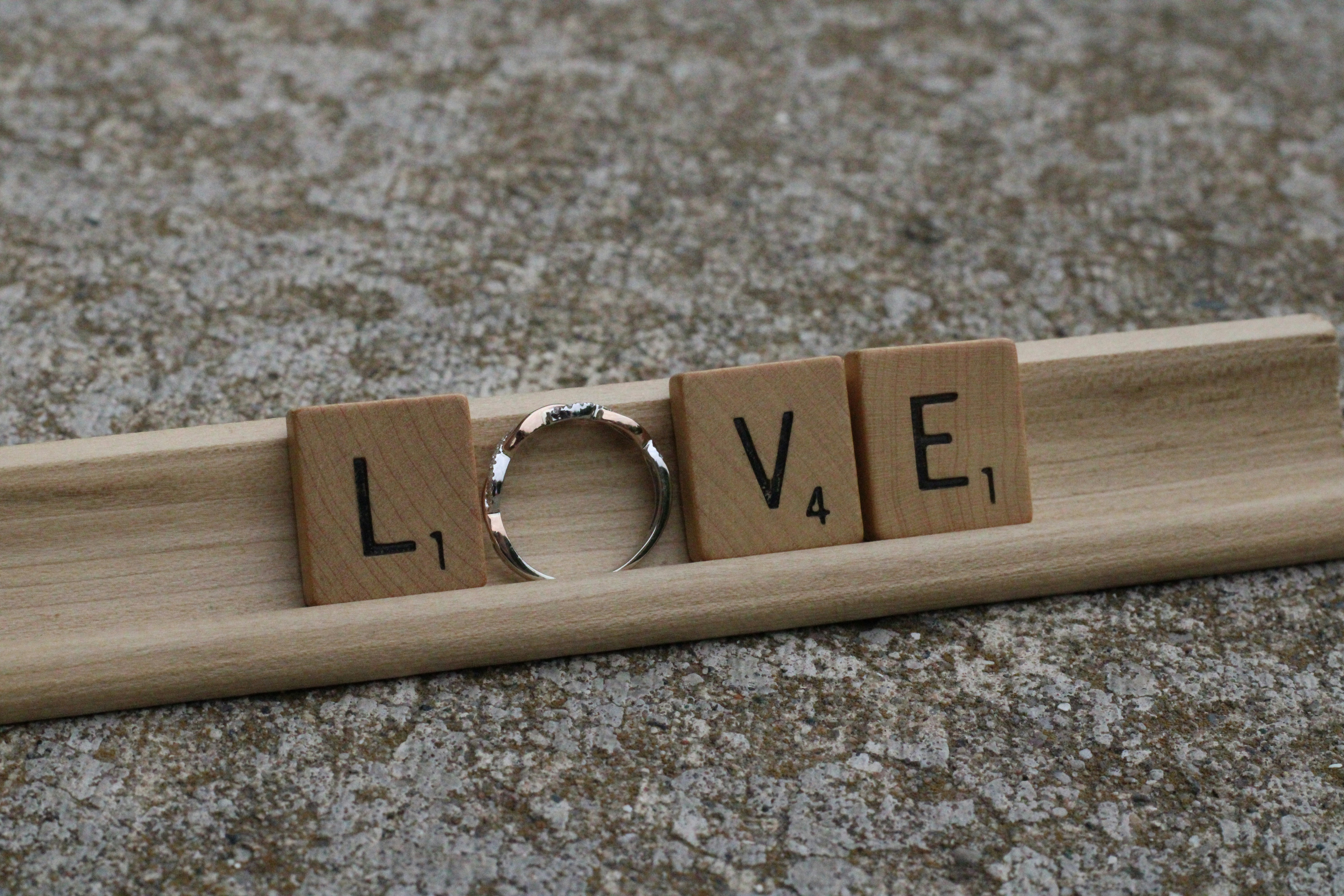 A wooden key on a wooden surface photo – Free Scrabble Image on Unsplash