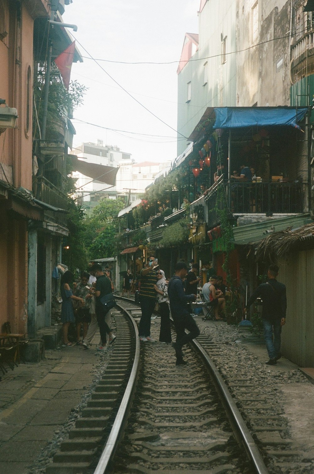 a group of people walking down a street