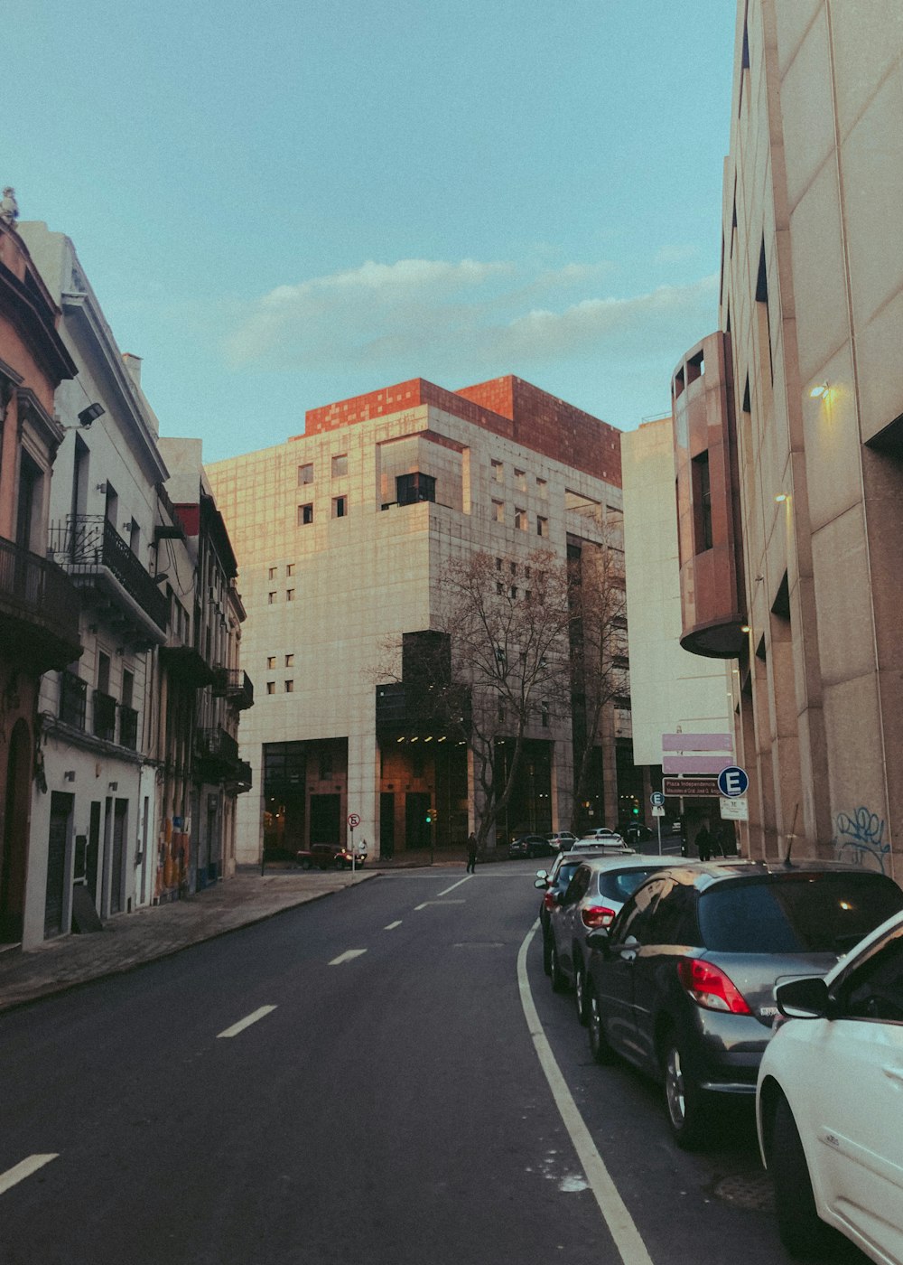 a street with cars parked along it