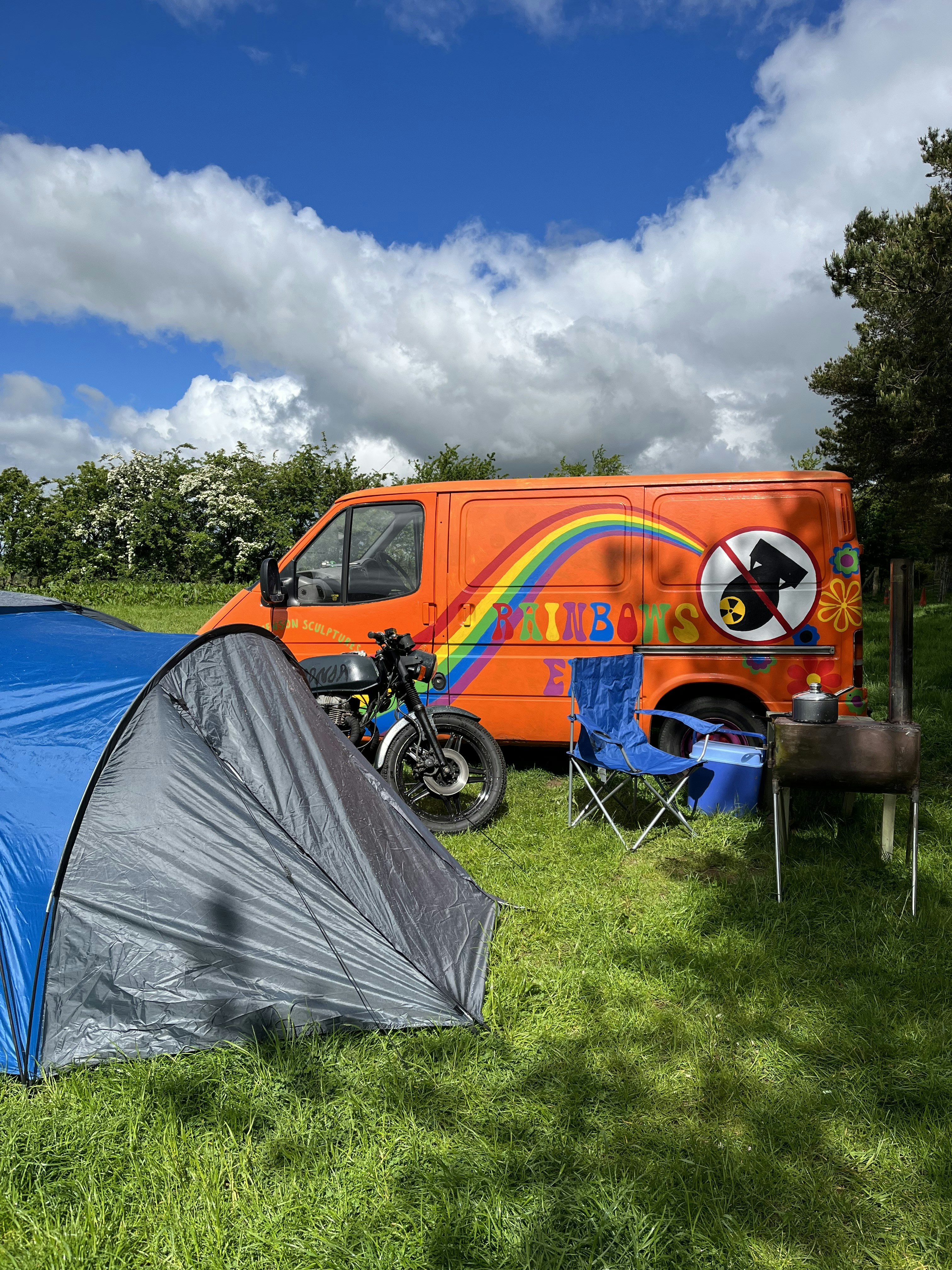 a motorcycle parked next to a tent