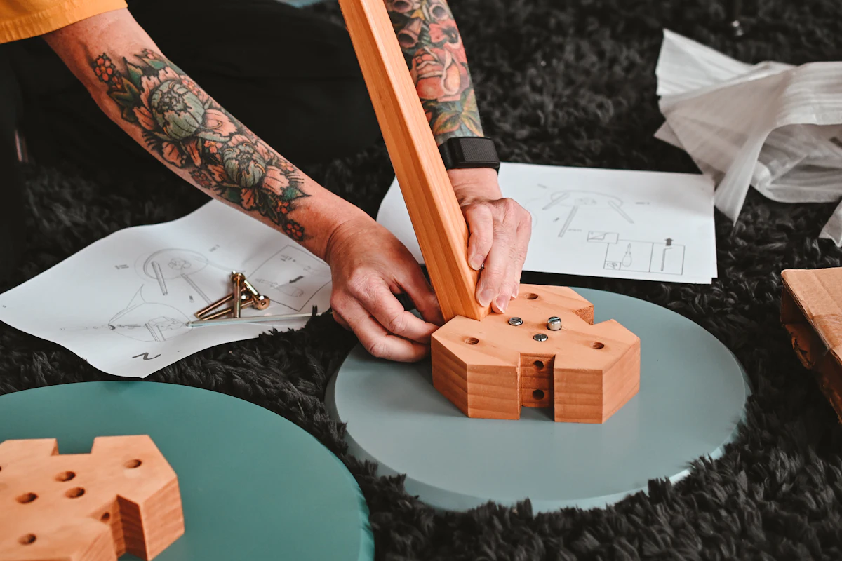 Furniture being assembled from its parts on the floor