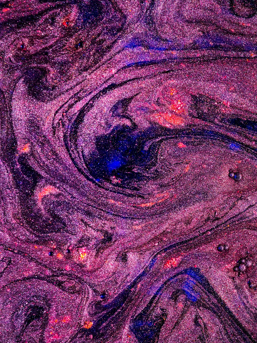a close up of a purple and pink blob