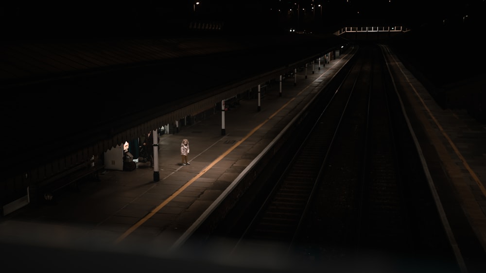 a person walking on a train platform