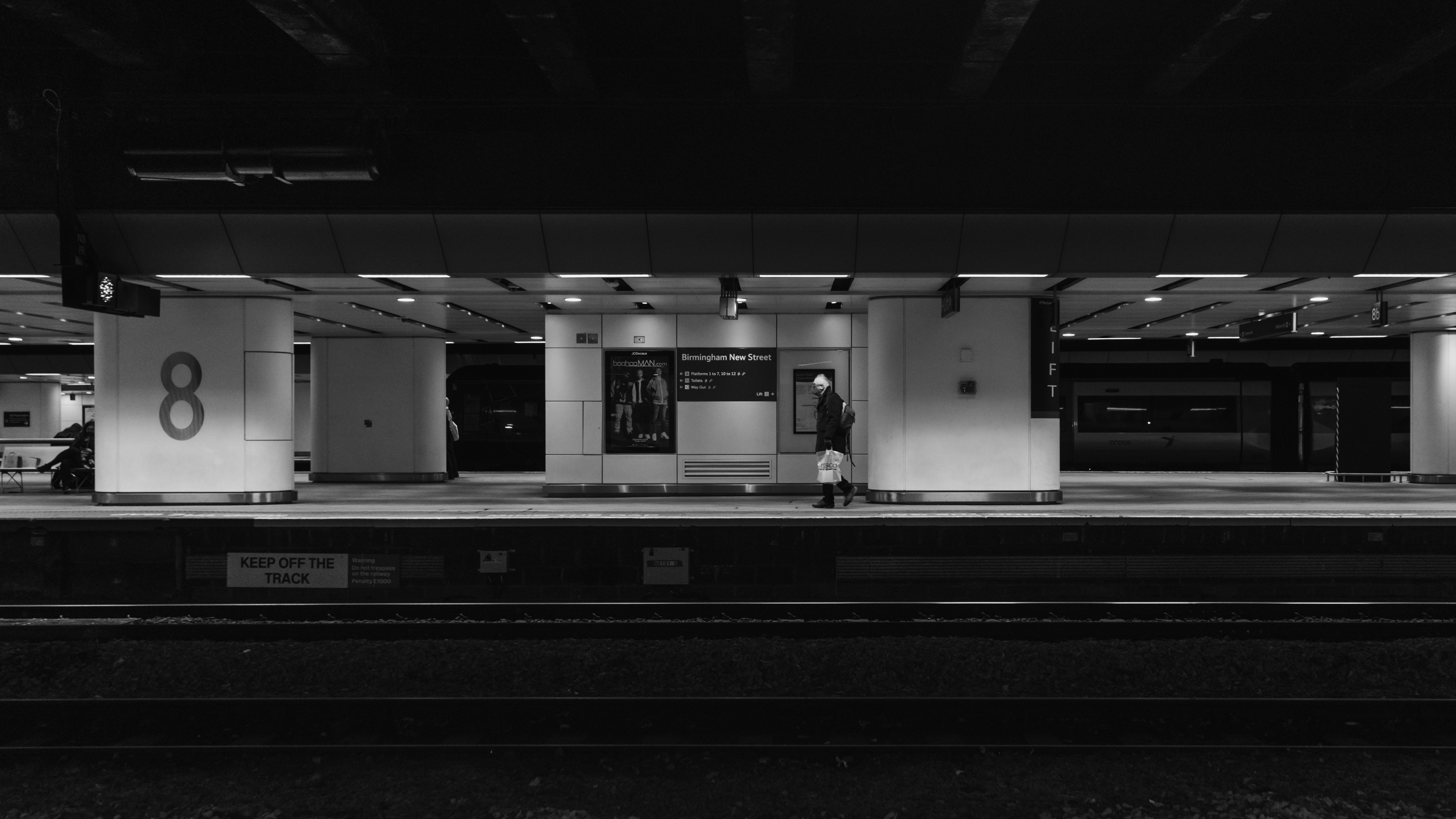 a person standing in a train station